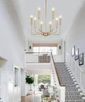 Gold 8 Light Farmhouse Chandelier With Modern Brass Candle Design in foyer, adjustable height, diameter 26 inches