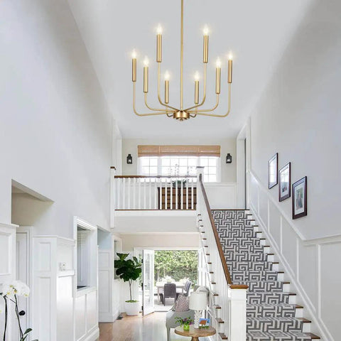 Gold 8 Light Farmhouse Chandelier With Modern Brass Candle Design in foyer, adjustable height, diameter 26 inches