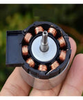 Brushless Servo Motor 12V DC With Built In Drive And PWM Speed Control in hand showing internal copper coils structure
