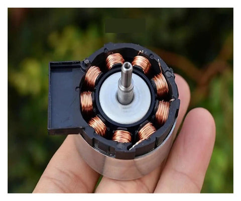 Brushless Servo Motor 12V DC With Built In Drive And PWM Speed Control in hand showing internal copper coils structure