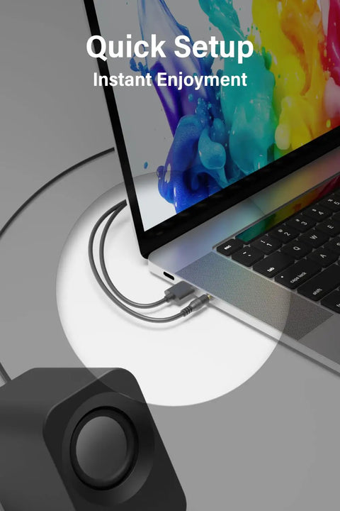 Black 14W USB powered stereo PC speakers connected to a laptop, highlighting 30 degree tilt design, compact size, crisp highs.