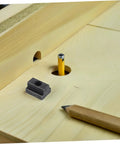 Six Piece Precision T Slot Bolt And Nut Assortment Kit For Machine Vise Tooling shown on wood surface with pencil and hole.