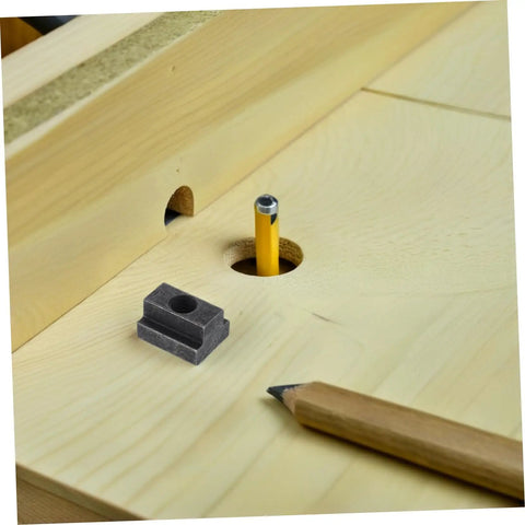 Six Piece Precision T Slot Bolt And Nut Assortment Kit For Machine Vise Tooling shown on wood surface with pencil and hole.