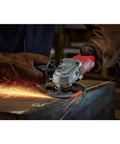 Heavy Duty Corded Angle Grinder 120 Volt With Soft Grip Handle cutting metal with sparks flying during use.