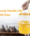 2L Water Dispenser Feeder With Handle For Pigeons, Poultry, Parrot, Duck Or Chicken next to pigeons showing handle use