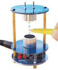 Ultrasonic Levitator Solder Practice Kit showing levitating beads with yellow tweezers, 12V adapter visible.