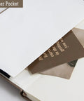 Inner pocket of Leather A5 Journal For Engineers with 200 lined pages, displaying inserted cards.