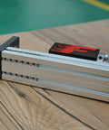 Dead Reliable Aluminum Mini Linear Stage Built Ridiculously Tight With Nema 23 Stepper Motor And Smooth G1610 Ballscrew For Sweet CNC Motion Control Plus Massive 300Mm Stroke Table on wooden surface.