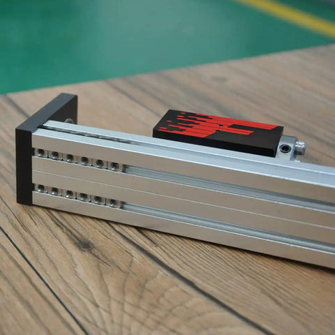 Dead Reliable Aluminum Mini Linear Stage Built Ridiculously Tight With Nema 23 Stepper Motor And Smooth G1610 Ballscrew For Sweet CNC Motion Control Plus Massive 300Mm Stroke Table on wooden surface.
