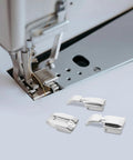 Sewing machine with components from Must Have Dope 5 Piece Multifunctional Sewing Machine Presser Foot Set With Adjustable Invisible Zipper Foot