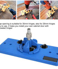 Front view of blue plastic hinge boring jig for cabinet doors with 35mm hole opener and drill guide.