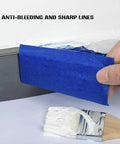 Person applying Blue Painter Tape 2 Inch Masking Tape Bulk For Multi Surface Projects With Sharp Lines And Residue Free Finish