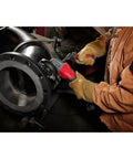 Top Tier Cordless Angle Grinder With Lightning Fast Dual Trigger Brake Plus Smart Kickback Shield used on metal pipe.