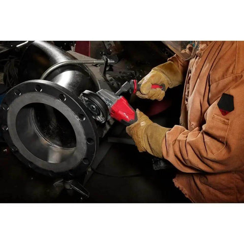 Top Tier Cordless Angle Grinder With Lightning Fast Dual Trigger Brake Plus Smart Kickback Shield used on metal pipe.