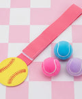 Softball Pitching Training Aid For Clean Mechanics And Realistic Throws, pink elastic band with softball and training balls
