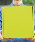 Person holding Green Corrugated Mailer Boxes 10 Pack For Shipping And Storage, Sturdy And Practical Boxes To Organize Supplies