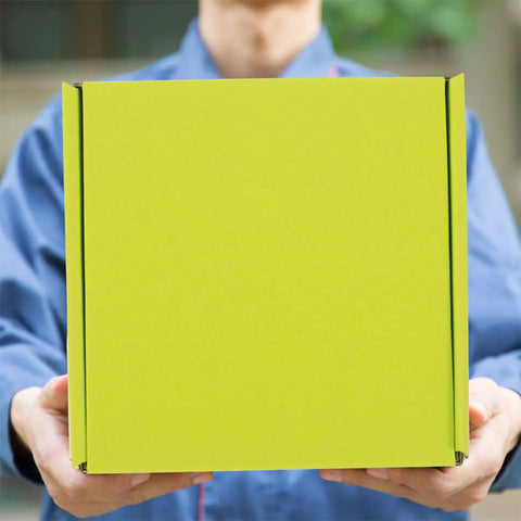 Person holding Green Corrugated Mailer Boxes 10 Pack For Shipping And Storage, Sturdy And Practical Boxes To Organize Supplies