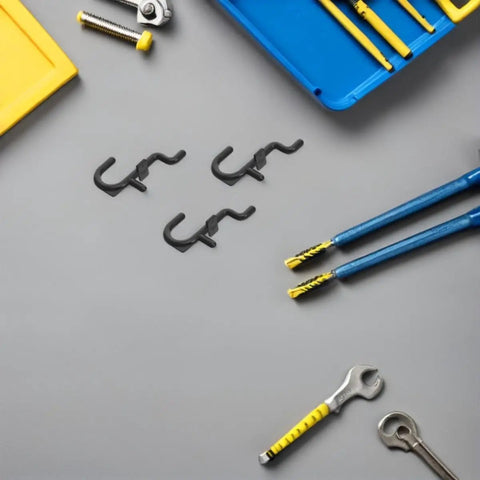150 Pcs Plastic Pegboard Hooks For Tool Storage And Small Kitchen Supplies, Heavy Duty Repositionable Pegboard Hangers With Easy Assembly, Ideal For Retail Displays And Garage Organization, Studio Gear Black on gray surface