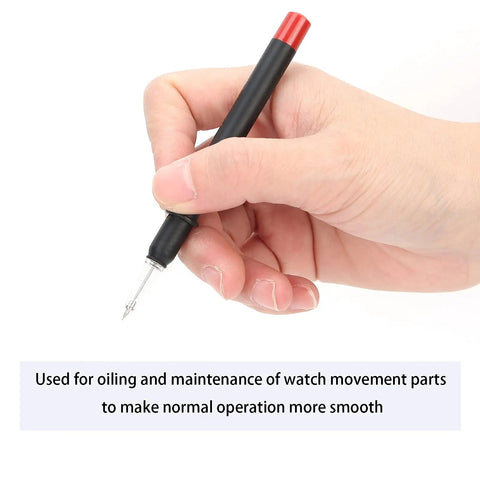 Hand holding Pro Grade Watch Oiler Pens With Base Automatic Precision Lubrication Tool For Watchmakers