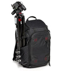 Pro Photo Backpack For Camera Gear Loadout With Four Access Points Front And Side Entry Triple Mode Interior Interchangeable Dividers Tripod Attachments Pro Grade Build M Guard Protection Black with a tripod attached on the side.