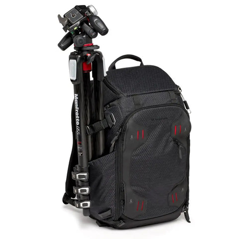 Pro Photo Backpack For Camera Gear Loadout With Four Access Points Front And Side Entry Triple Mode Interior Interchangeable Dividers Tripod Attachments Pro Grade Build M Guard Protection Black with a tripod attached on the side.