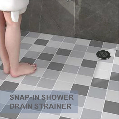 Heavy Duty Matte Black Snap In Shower Drain Cover Slick Round Stainless Steel Grid For Modern Bathrooms in a tiled shower.