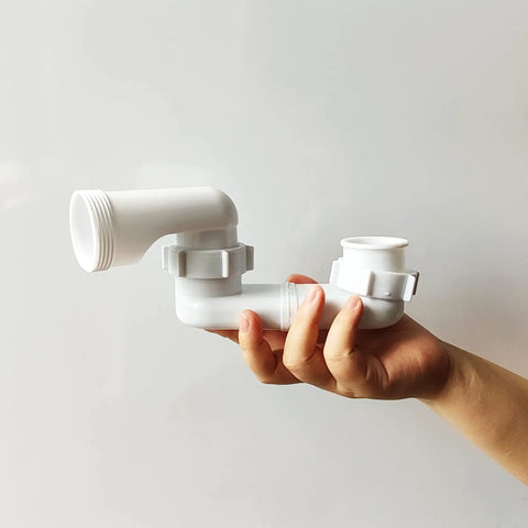 Low Profile Shower Drain Trap Kit 1.5 Inch For Small Bathrooms Flat PVC Waste Pipe System held in a hand