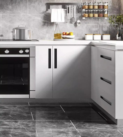 Modern kitchen with sleek cabinets featuring hidden black drawer pulls with embedded design, durable zinc alloy, and aluminum construction.