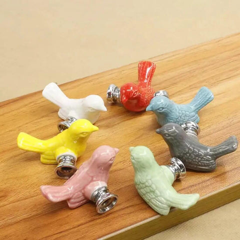 Fresh Vintage Style Yellow Ceramic Bird Cabinet Knob Set With Four Pack Drawer Pulls For Cupboards And Kitchen Cabinets Featuring High Gloss Finish And Dead Simple Install Bold Home Refresh. Assorted colors displayed on wood.