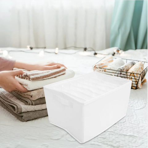 Slick Underwear Drawer Organizer With Divided Compartments For Bras Socks And Clothes To Keep Your Closet Neat And Legit A Versatile Large Capacity Storage Box, white fabric organizer holding folded towels.