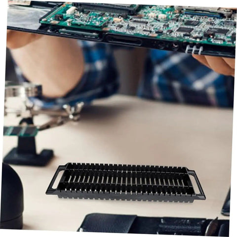 Circuit Board Storage Stand Pack Of 4 ESD Rack Anti Static Shelf PCB Holder For Display And Safe Storage Of Printed Circuit Boards On Workbench Or Cabinet Durable And DIY Friendly image showing a black anti-static PCB rack on a workbench, with a technician handling a circuit board.