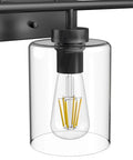 Close-up of Three Light Black Vanity Light Fixture Over Mirror With Clear Glass Shades Industrial Wall Light For Bathroom Upgrade Modern Vintage Look Matte Black Frame