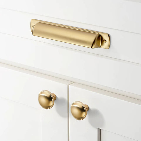 10 Pack Champagne Bronze Cabinet Knobs One And A Quarter Inch Solid Round Drawer Pulls With Screws Included For Cupboard And Dresser Cabinets No Fuss Upgrade For Kitchens And Furniture shown on white cabinetry.