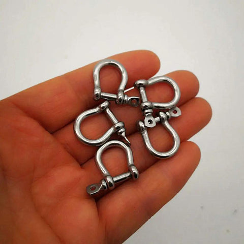 Built Like A Tank Marine Grade 316 Stainless Steel Bow Shackles 3Mm Mini Links in hand for paracord crafts, five pack.