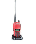 Red Beefy 7W Dual Band Ham Radio Portable Two Way With VHF 136 174 MHz And UHF 400 520 MHz VOX on charging dock.