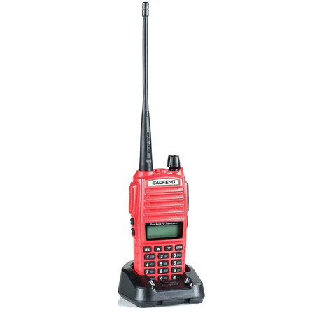 Red Beefy 7W Dual Band Ham Radio Portable Two Way With VHF 136 174 MHz And UHF 400 520 MHz VOX on charging dock.