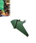 Green downward dust collector chute for Woodland Mills HM130 sawmill, designed to enhance visibility and clean up sawdust efficiently.