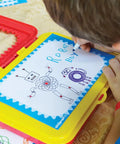 Child drawing on Jumbo Spiral Gear Art Kit for Kids 3 And Up, showing colorful spiral robot design and easy grip gears.