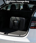 Portable Tesla Wall Connector Featuring No Sweat Nema 10 30 Plug Method Level 2 Ev Speed Charger With Tunable Amps in a black storage bag in a car trunk.