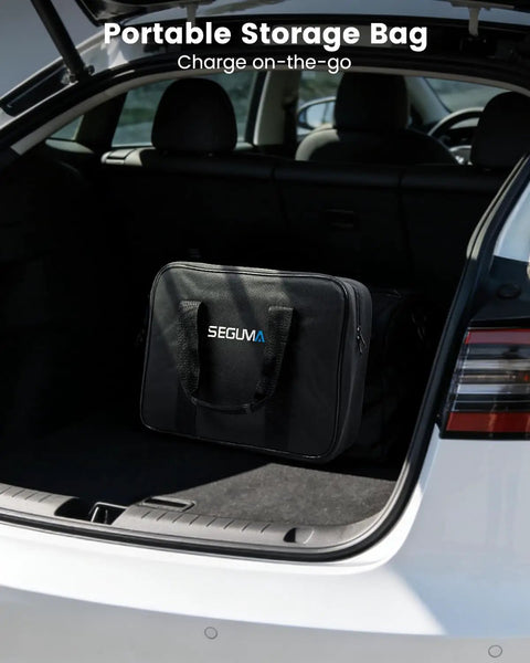 Portable Tesla Wall Connector Featuring No Sweat Nema 10 30 Plug Method Level 2 Ev Speed Charger With Tunable Amps in a black storage bag in a car trunk.