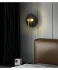 Retro Round Wall Sconces Crafted From Premium Copper With Rust Proof Build And Glare Free Warm Glow To Level Up Your Bedroom Bedside Or Living Room Setup Today 32 Cm Fixture mounted beside a bed.