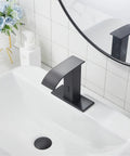 Automatic Sensor Matte Black Touchless Bathroom Sink Faucet With Drain Assembly installed in modern bathroom.