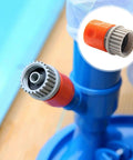 Close-up of Screw Man Quick Coupler on a blue pool vacuum head; orange body with gray threaded collar