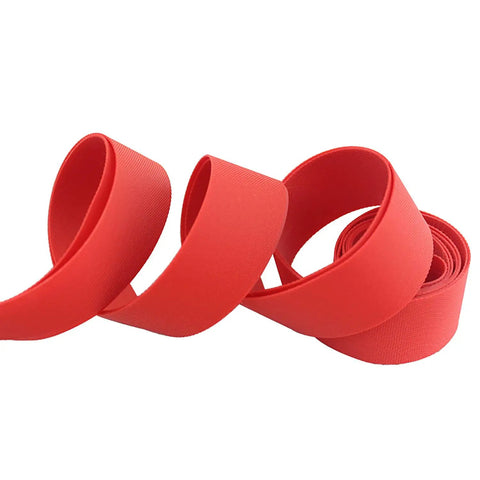 Beefed Up 26 Inch Rim Tape And Strips 20mm Elastic Nylon Red 2 Pack for road and mountain bikes, close-up of coiled red tape.
