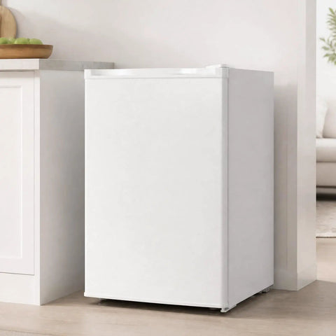 White 3.0 Cu Ft Upright Freezer With 7 Adjustable Temp Settings Compact Mini Freezer in kitchen corner for space saving.