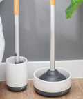 Toilet Brush With Ceramic Holder And Instant Dry Coating For Mold And Mildew Prevention, shown in bathroom setting.