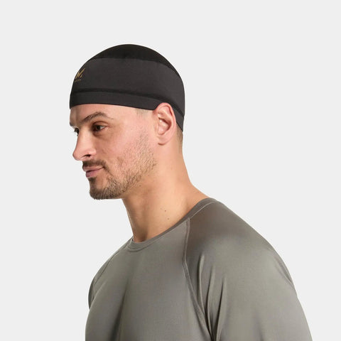 Black cooling helmet liner on man for under helmets, offering UPF 50 sun protection for sports and outdoor activities