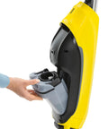 Person removing water tank from Electric Mop And Floor Cleaner For All Hard Floors Cordless With 500 RPM Front Rotating Rollers