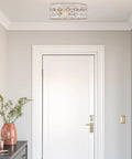Rustic Farmhouse 3 Light Flush Mount Ceiling Light with Metal Cage Drum Shade, shown in bright hallway, 17 Inch diameter, walnut and black accents
