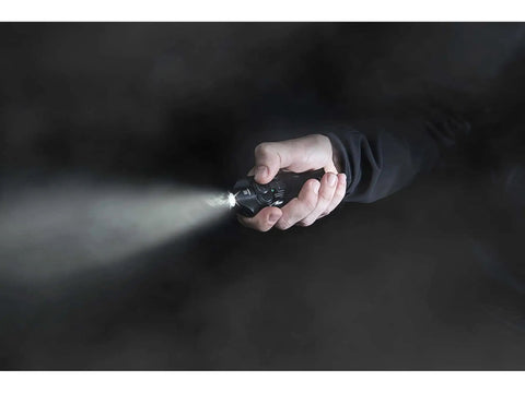 Person holding Blue Pocket Light That Fits In Your Hand And In Your Pocket, Built To Last For Go To Everyday Carry, emitting beam in dark